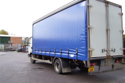 Mid-Blue Side Curtains With Black Pelmets